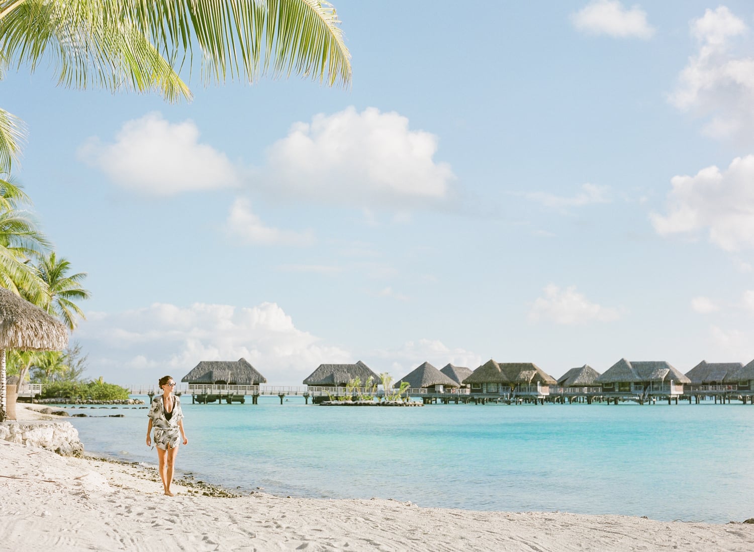 Elena walking on the beach during her photo shoot portrait session at the Intercontinental Thalasso in Bora Bora