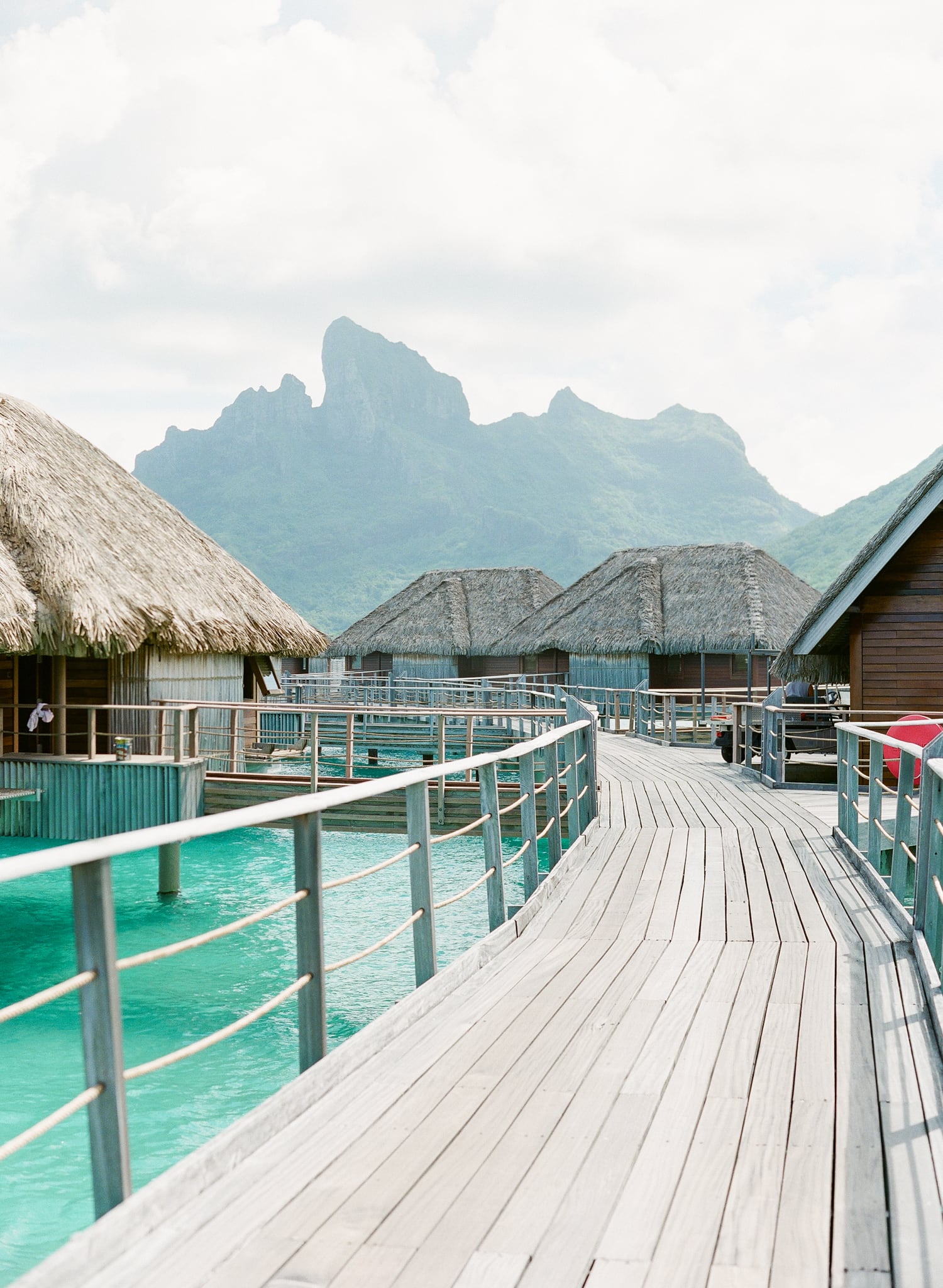 View with the overwater bungalow, the path in the Four Seasons Bora Bora