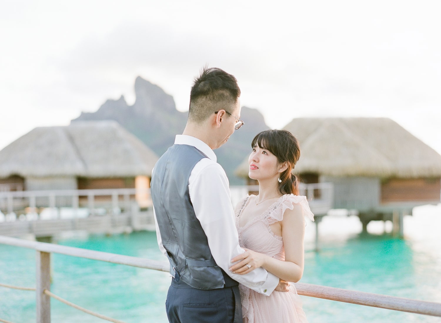 Bride and groom at sunset in the Four seasons Bora Bora