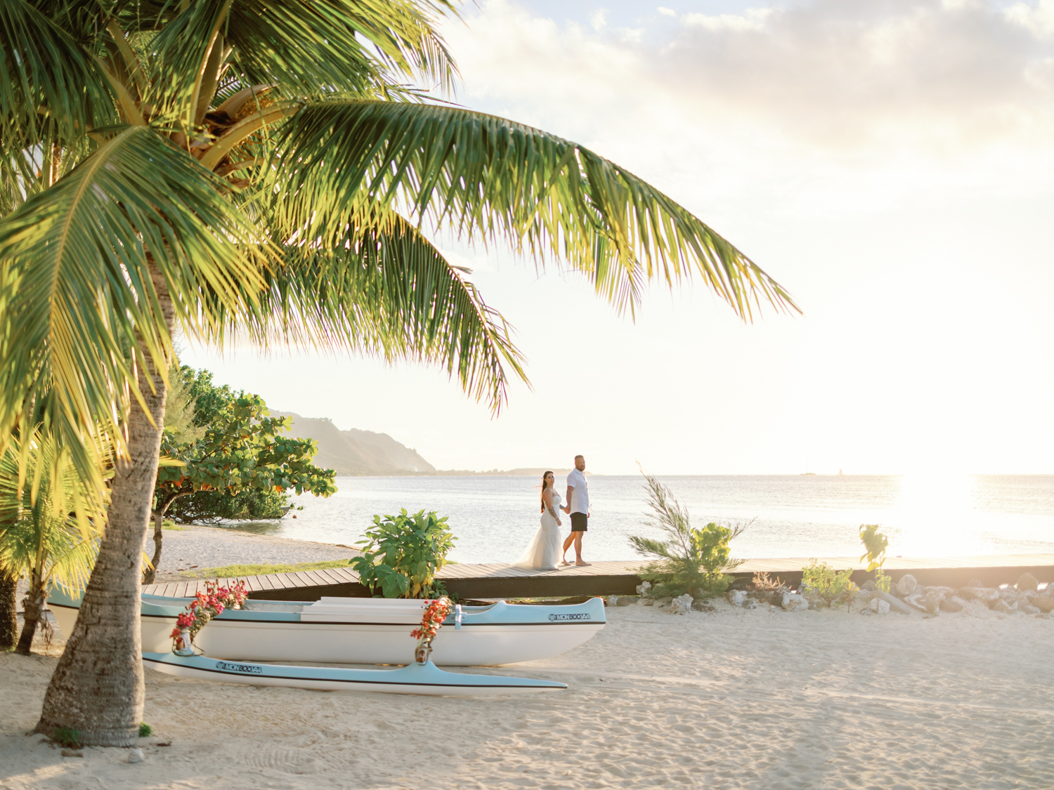James and Becca at the Hilton Moorea at the sunset couple golden light with landscape