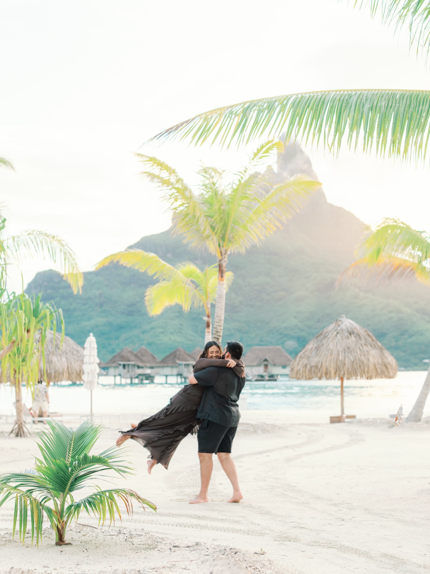 Action couple happy on the beach of bora bora